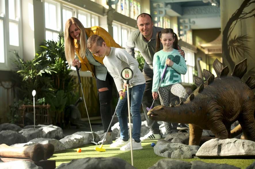 Family Playing Mini Golf at Dino Mini Golf at the Blackpool Tower