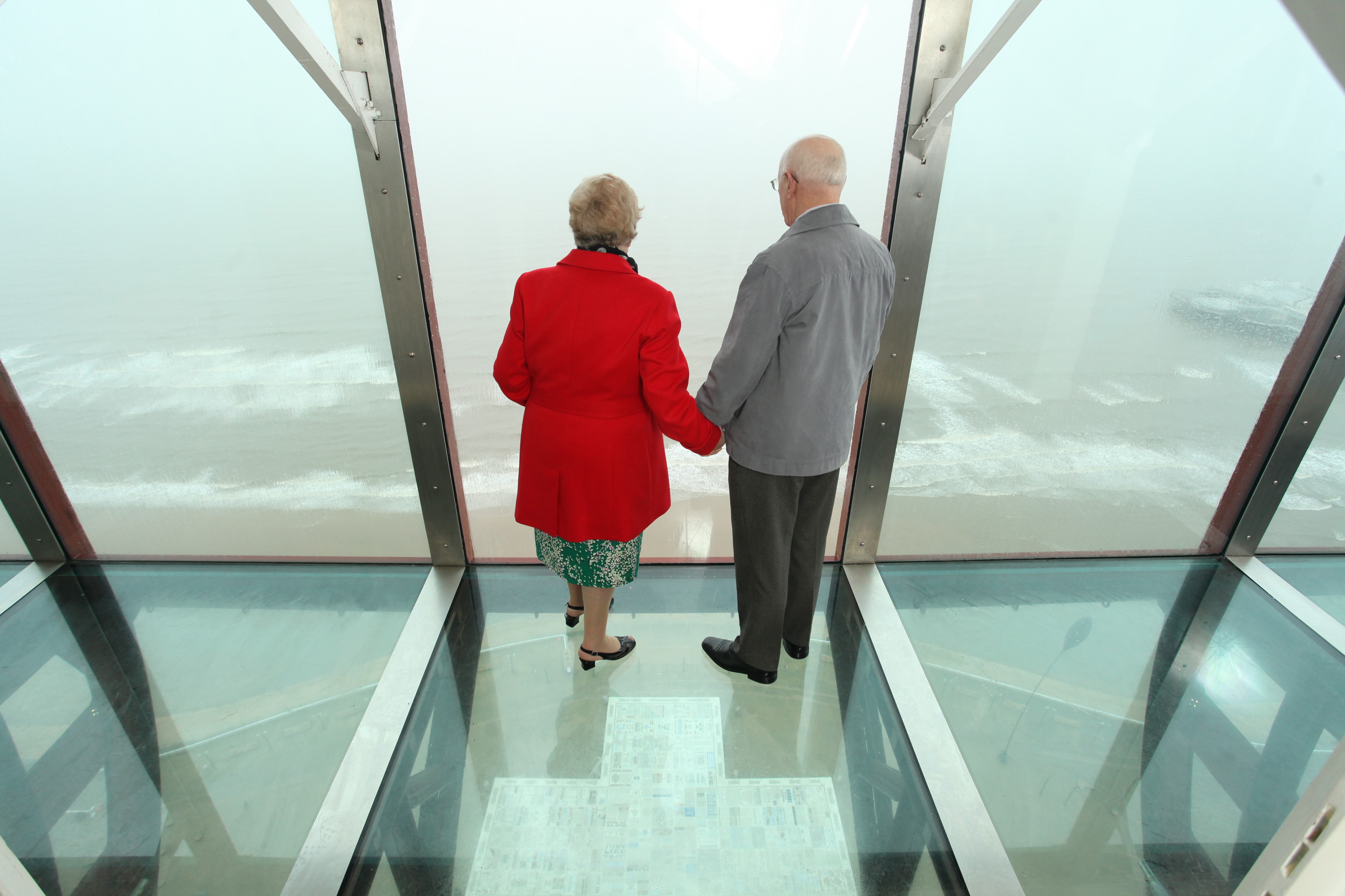 Couple looking at the view on top of the Blackpool Tower Eye